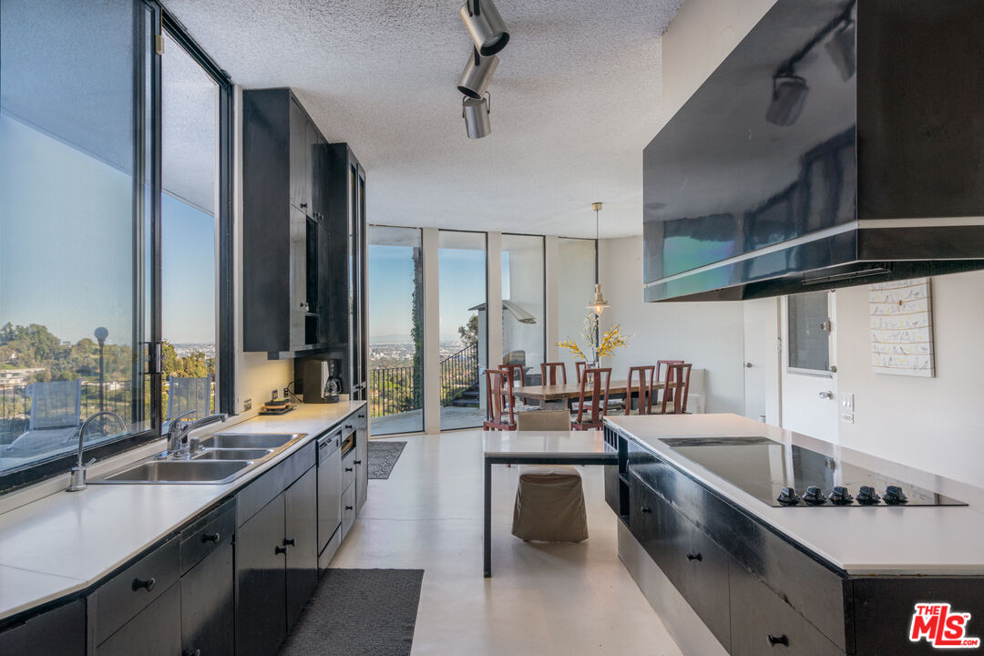 960 Stradella Road Los Angeles, CA 90077 - Photo 8 of 17 a large kitchen with lots of counter space