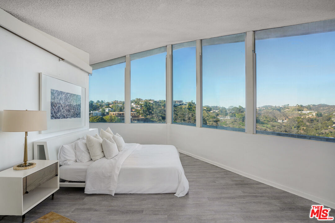 960 Stradella Road Los Angeles, CA 90077 - Photo 9 of 17 a living room with furniture and large windows