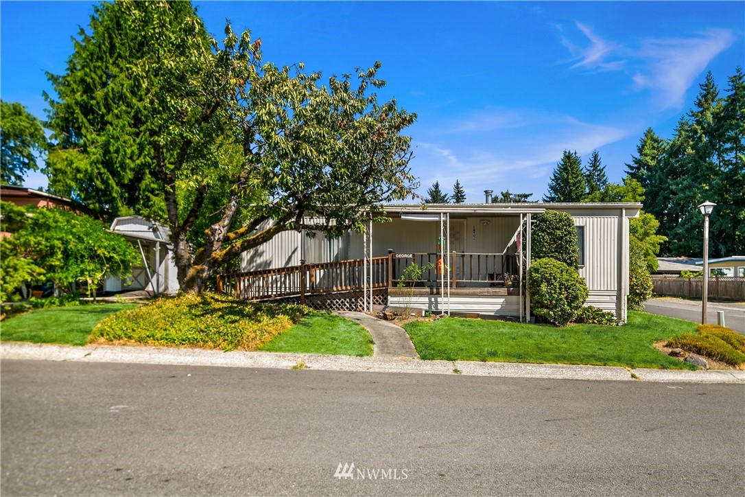 18902 128th Place Northeast Bothell, WA 98011 - Photo 15 of 15 front view of a house with a yard and potted plants