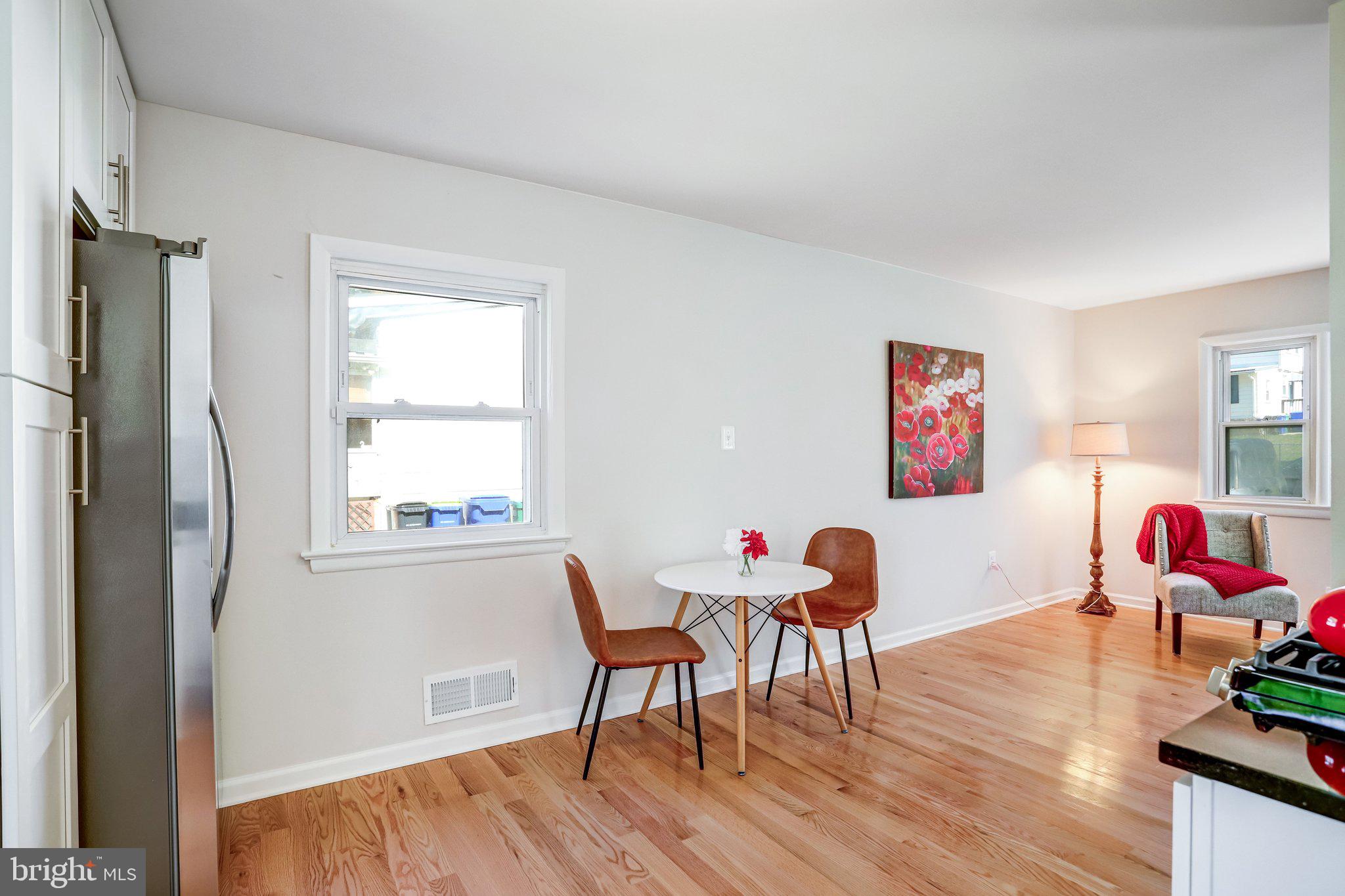616 Ritchie Avenue Silver Spring, MD 20910 - Photo 10 of 37 a living room with furniture and a wooden floor