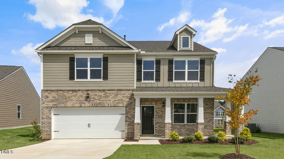 1305 Pavo Path Wendell, NC 27591 - Photo 1 of 55 a front view of a house with a yard