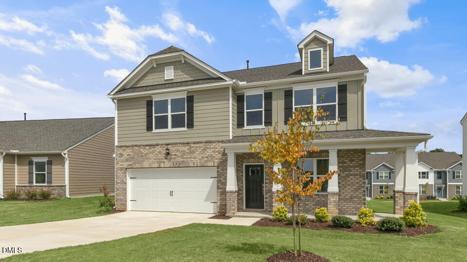 1305 Pavo Path Wendell, NC 27591 - Photo 2 of 55 front view of a house with a yard
