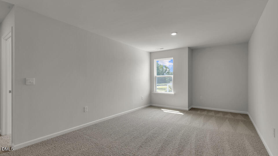 1305 Pavo Path Wendell, NC 27591 - Photo 21 of 55 an empty room with windows