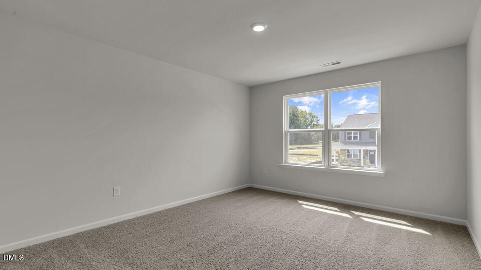 1305 Pavo Path Wendell, NC 27591 - Photo 28 of 55 an empty room with a window