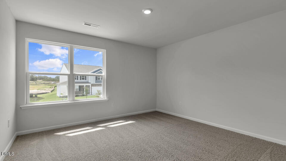 1305 Pavo Path Wendell, NC 27591 - Photo 32 of 55 an empty room with a window