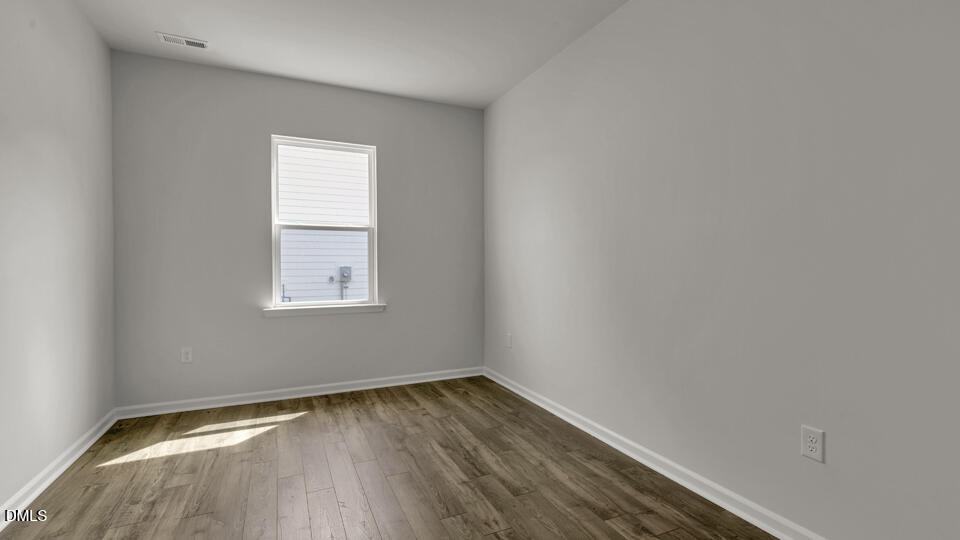 1305 Pavo Path Wendell, NC 27591 - Photo 8 of 55 a view of a room that has wooden floor and windows in it