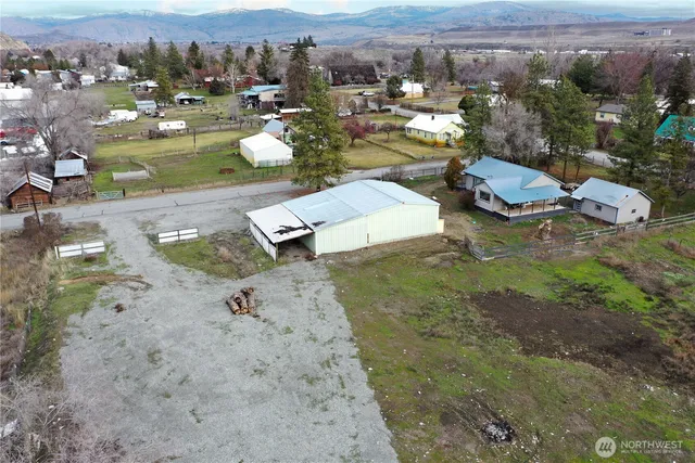an aerial view of a house with a yard