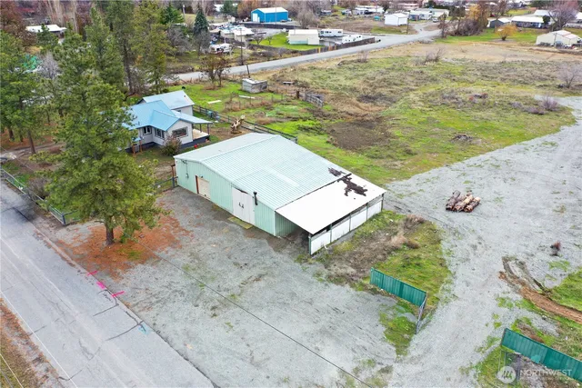 a view of a house with a yard and a ocean