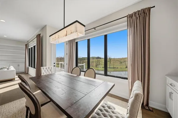 a spacious bedroom with a bed and large window