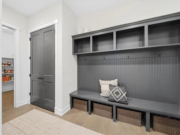 a bedroom with a bed and a mirror