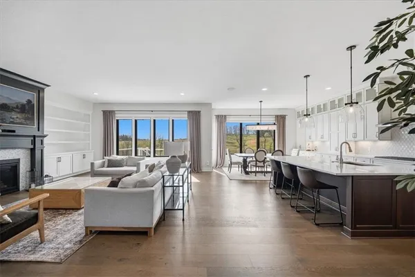 a large kitchen with a table and chairs