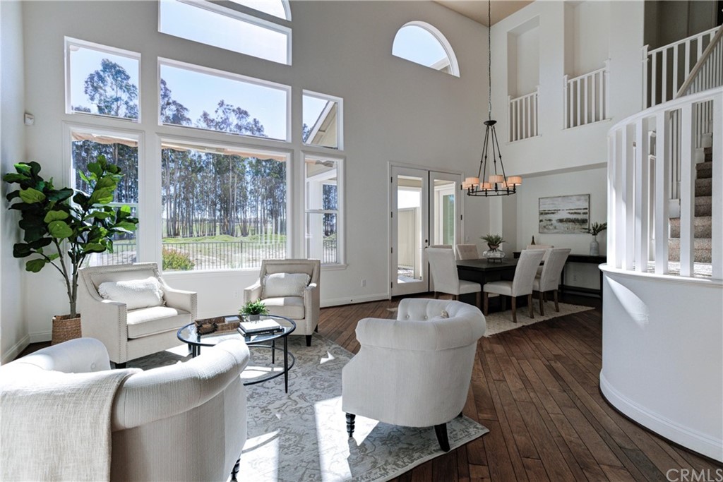 1715 Trilogy Parkway Nipomo, CA 93444 - Photo 11 of 69 a living room with furniture a chandelier and a window