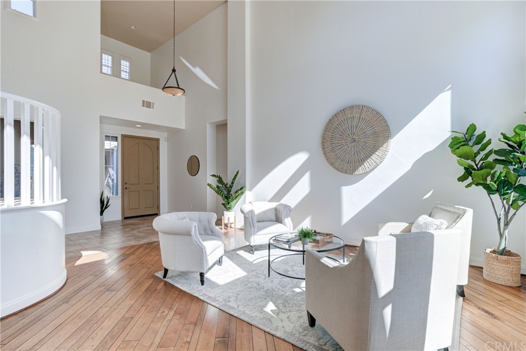 1715 Trilogy Parkway Nipomo, CA 93444 - Photo 13 of 69 a living room with furniture flowers and wooden floor