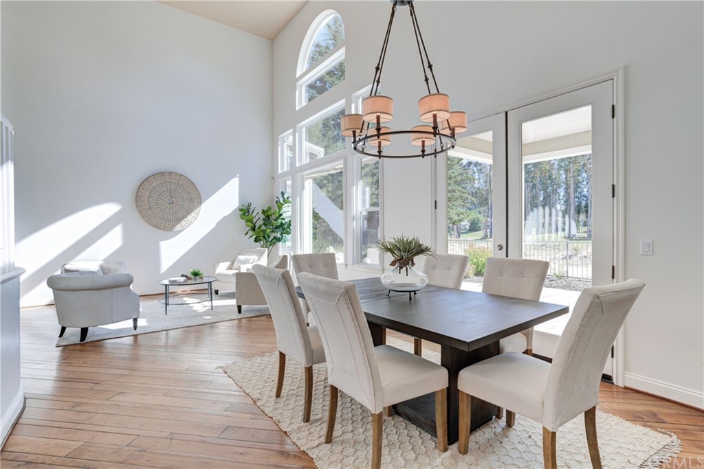 1715 Trilogy Parkway Nipomo, CA 93444 - Photo 15 of 69 a dining room with furniture a chandelier and wooden floor