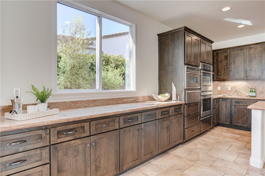 1715 Trilogy Parkway Nipomo, CA 93444 - Photo 22 of 69 a kitchen with a sink stove and cabinets