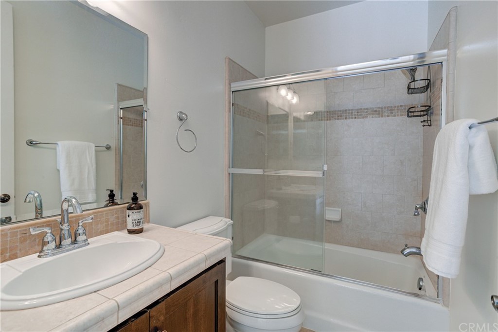 1715 Trilogy Parkway Nipomo, CA 93444 - Photo 39 of 69 a bathroom with a granite countertop bathtub shower sink vanity and toilet