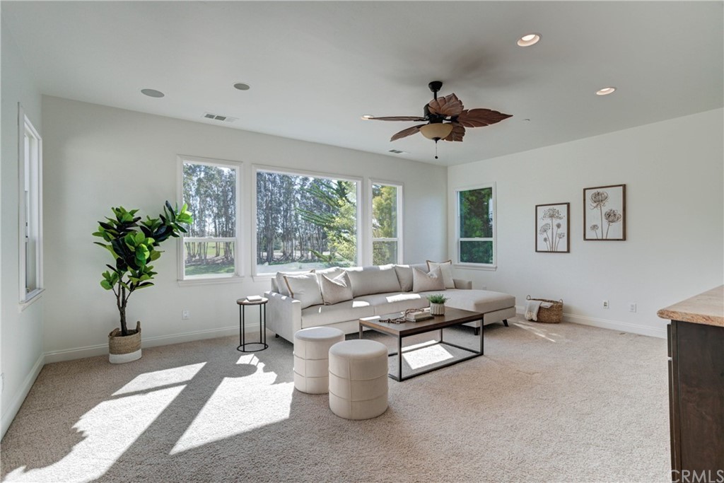 1715 Trilogy Parkway Nipomo, CA 93444 - Photo 40 of 69 a living room with furniture and a potted plant