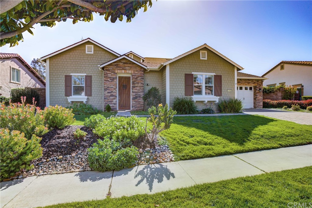 1715 Trilogy Parkway Nipomo, CA 93444 - Photo 4 of 69 a front view of a house with a yard