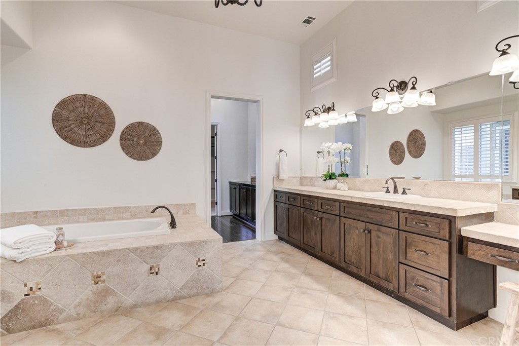 1715 Trilogy Parkway Nipomo, CA 93444 - Photo 48 of 69 a spacious bathroom with a double vanity sink mirror and bathtub