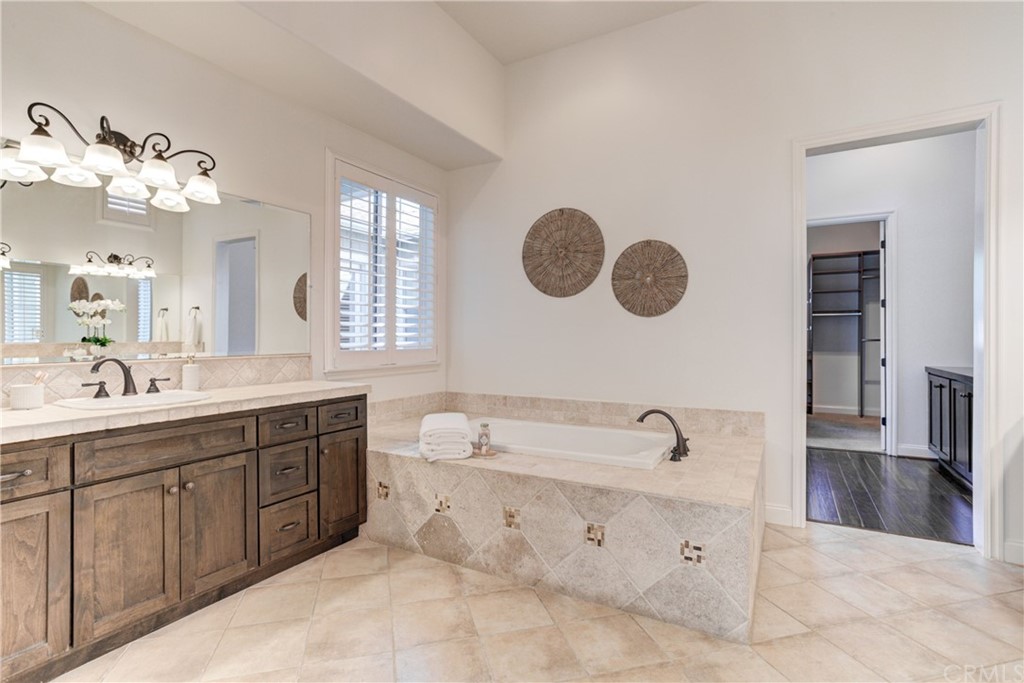 1715 Trilogy Parkway Nipomo, CA 93444 - Photo 49 of 69 a spacious bathroom with a double vanity sink mirror and