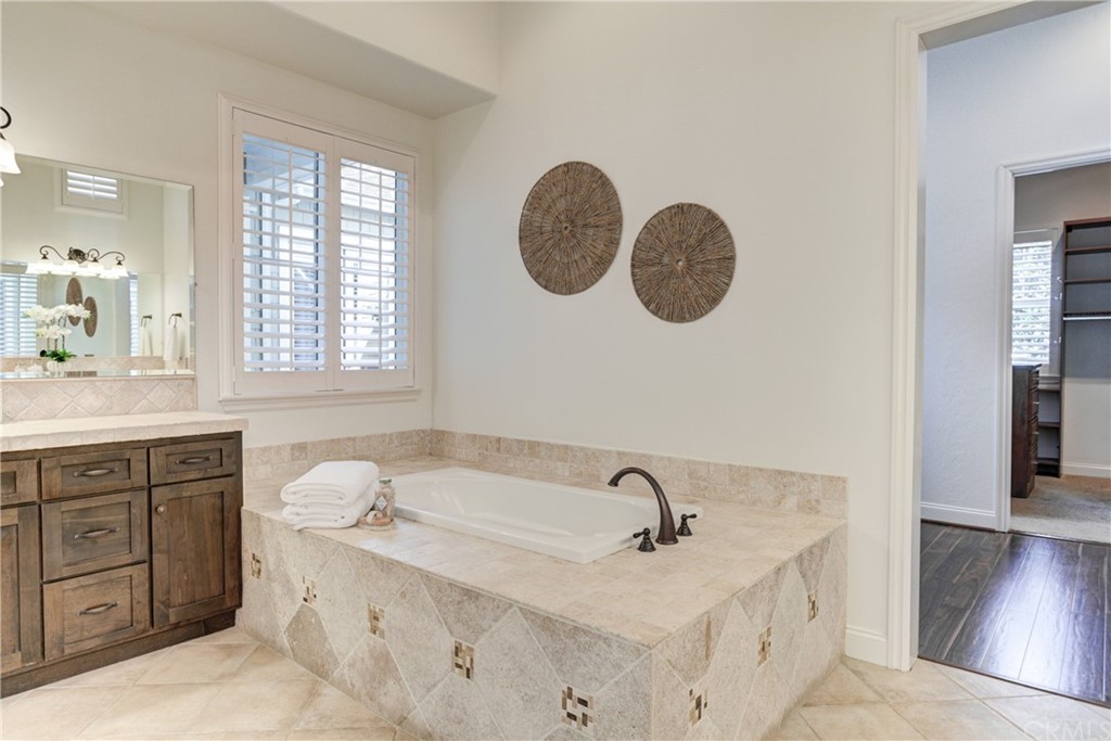 1715 Trilogy Parkway Nipomo, CA 93444 - Photo 50 of 69 a bathroom with a granite countertop sink and a mirror