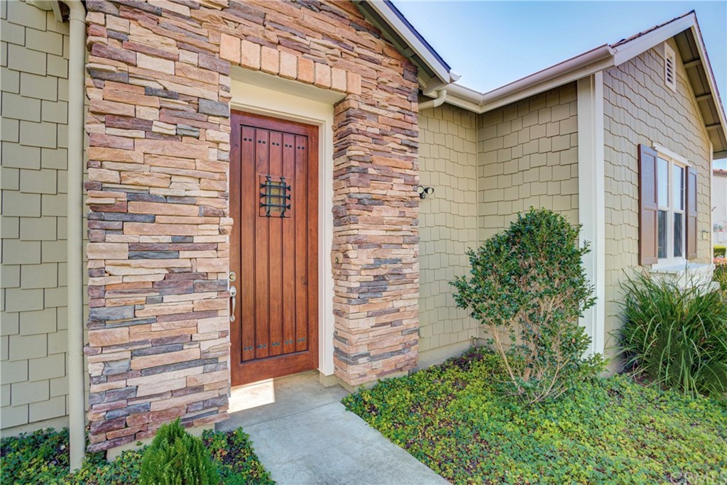 1715 Trilogy Parkway Nipomo, CA 93444 - Photo 6 of 69 a front view of a house with a garden