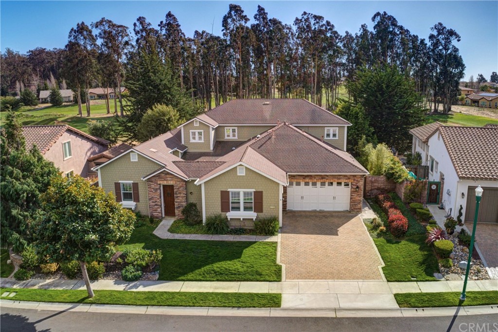 1715 Trilogy Parkway Nipomo, CA 93444 - Photo 62 of 69 a front view of a house with a garden