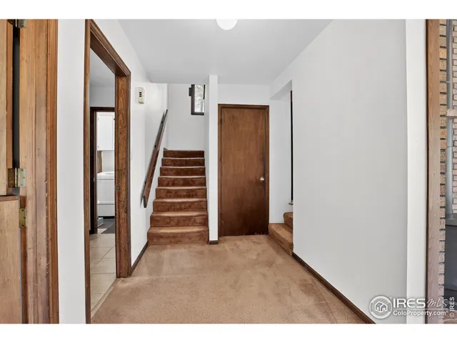 a view of empty room with stairs