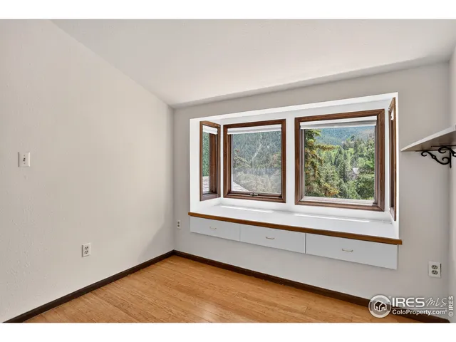 a view of an empty room with a window