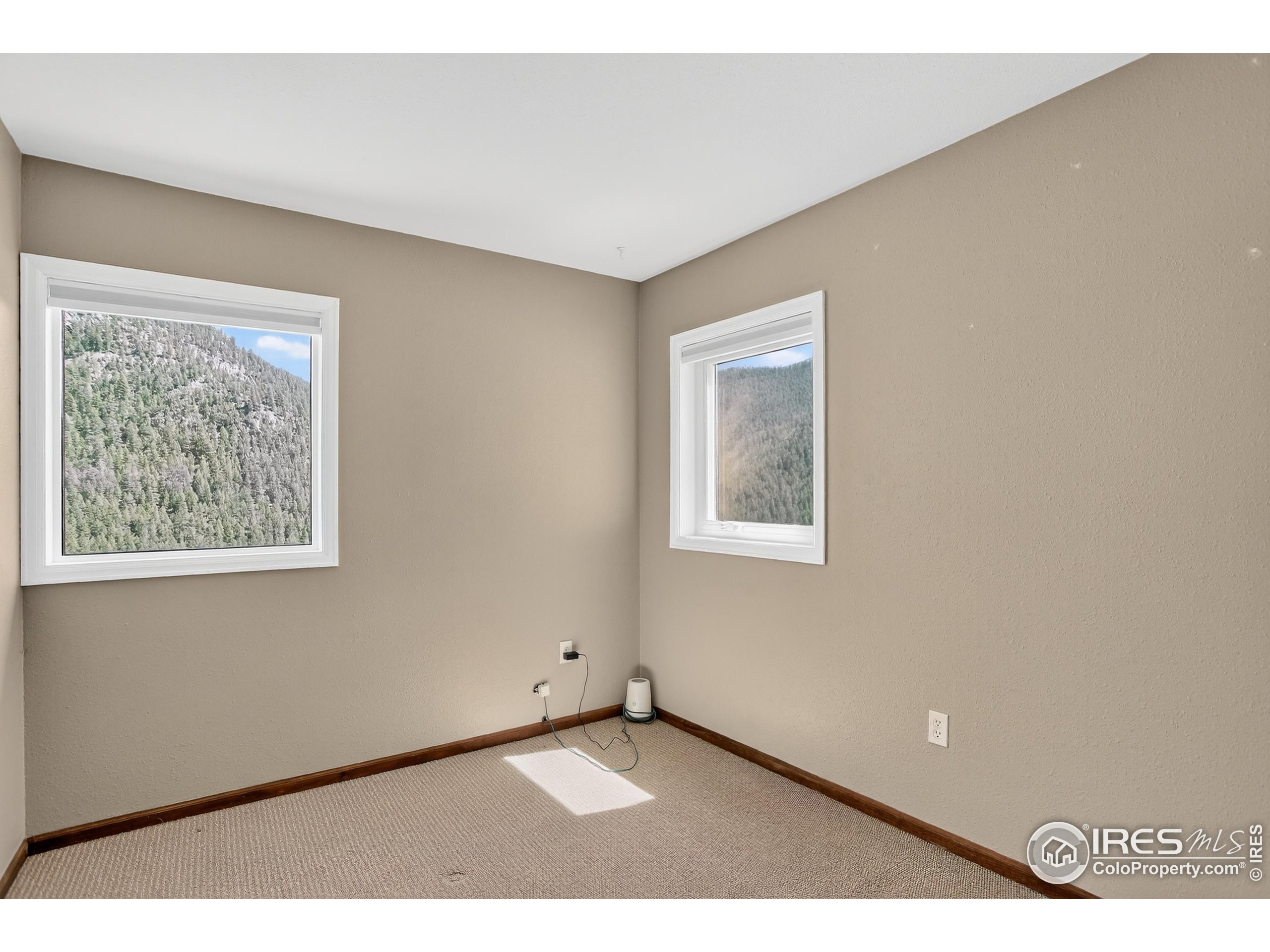 192 Nugget Hill Road Jamestown, CO 80455 - Photo 5 of 25 a view of an empty room with a window