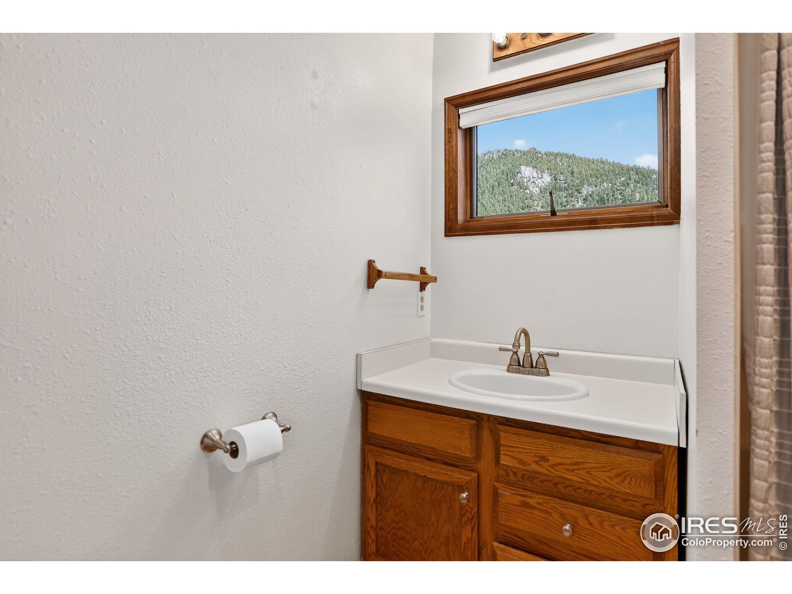 192 Nugget Hill Road Jamestown, CO 80455 - Photo 7 of 25 a bathroom with a sink and mirror