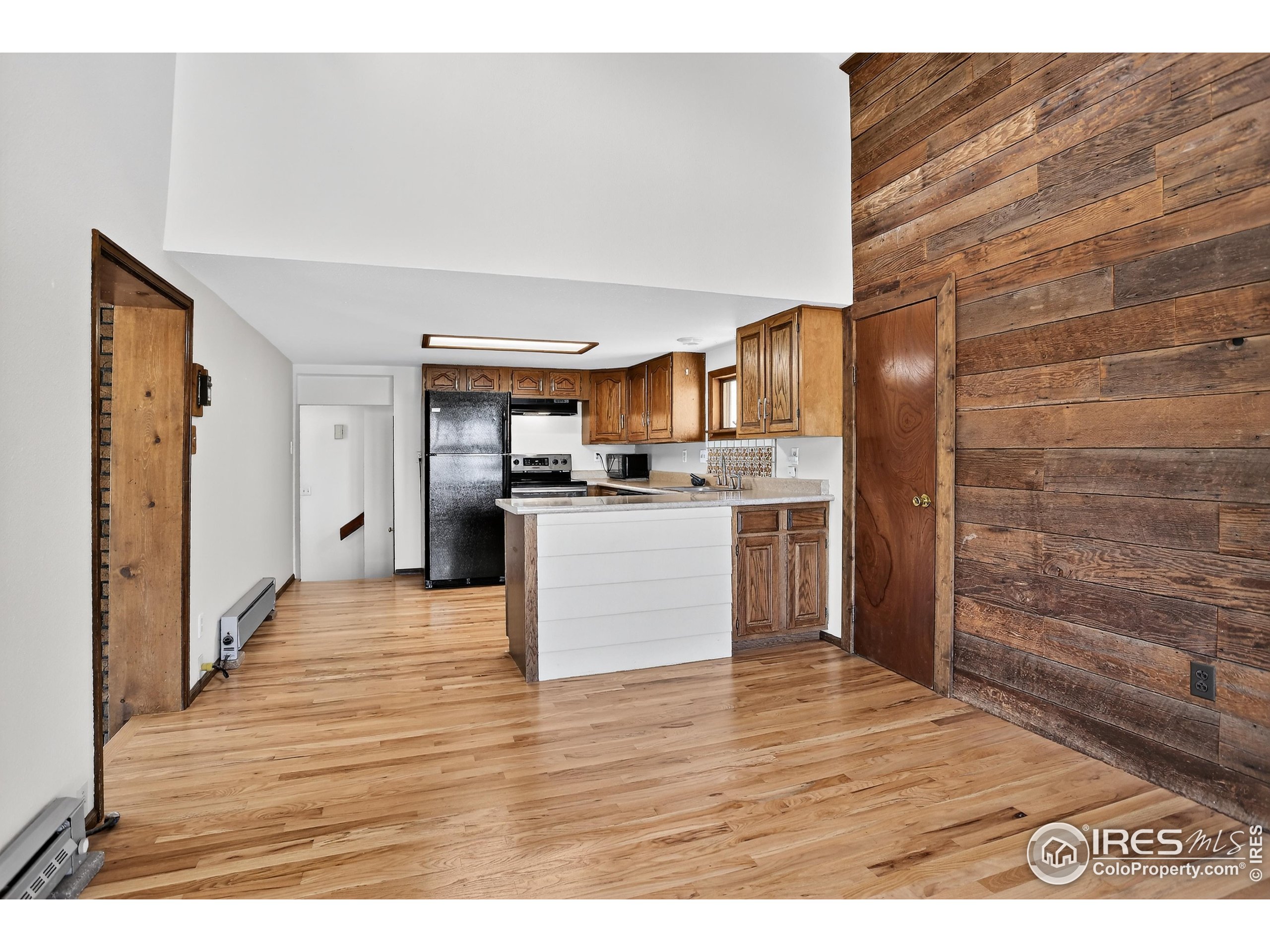 192 Nugget Hill Road Jamestown, CO 80455 - Photo 10 of 25 a view of kitchen with wooden floor