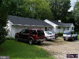 a car parked in front of a house