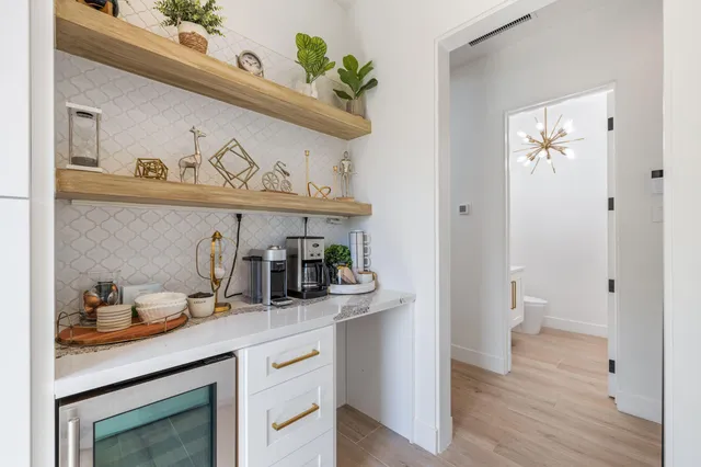 a view of bathroom with sink and wooden floor