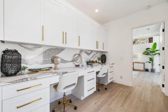 a utility room with cabinets a washer and dryer