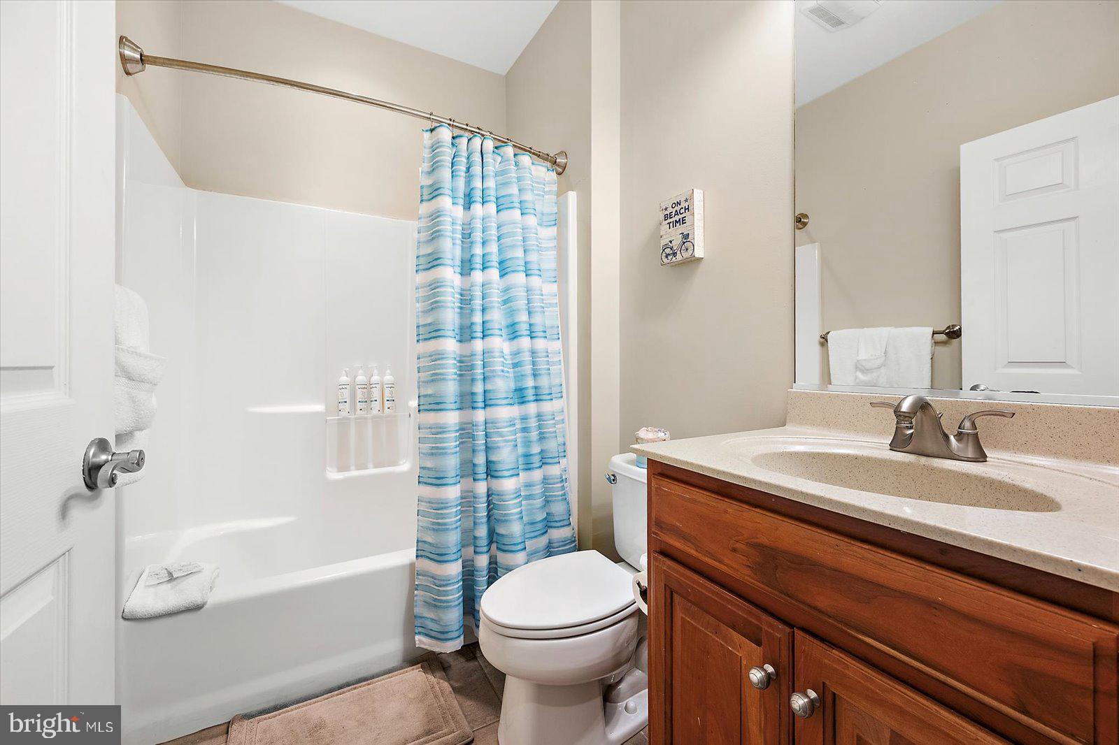 11446 West Sand Cove Road Selbyville, DE 19975 - Photo 38 of 104 a bathroom with a sink toilet and shower