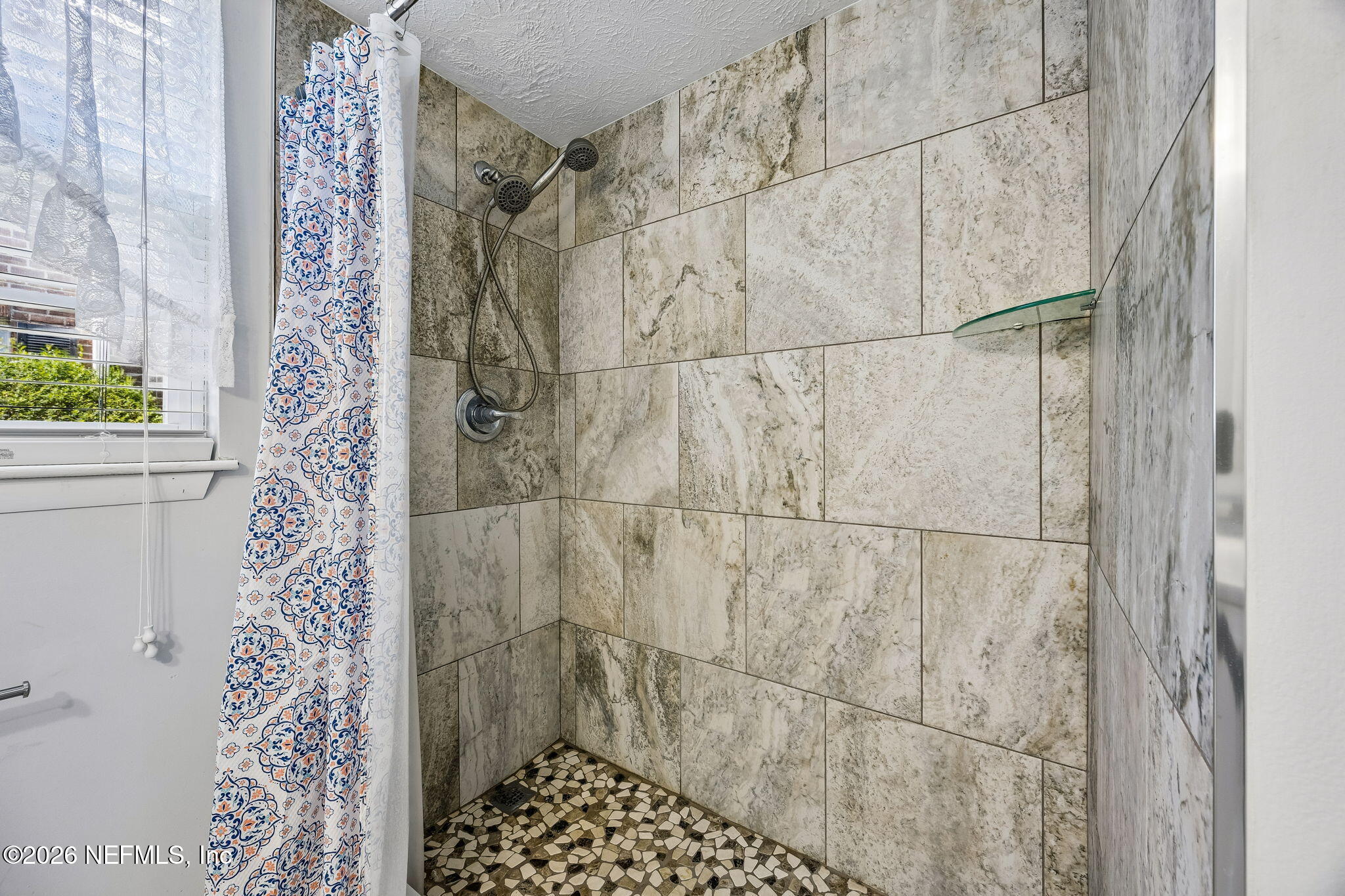 4358 Timuquana Road, Unit 134 Jacksonville, FL 32210 - Photo 11 of 31 a bathroom with a shower