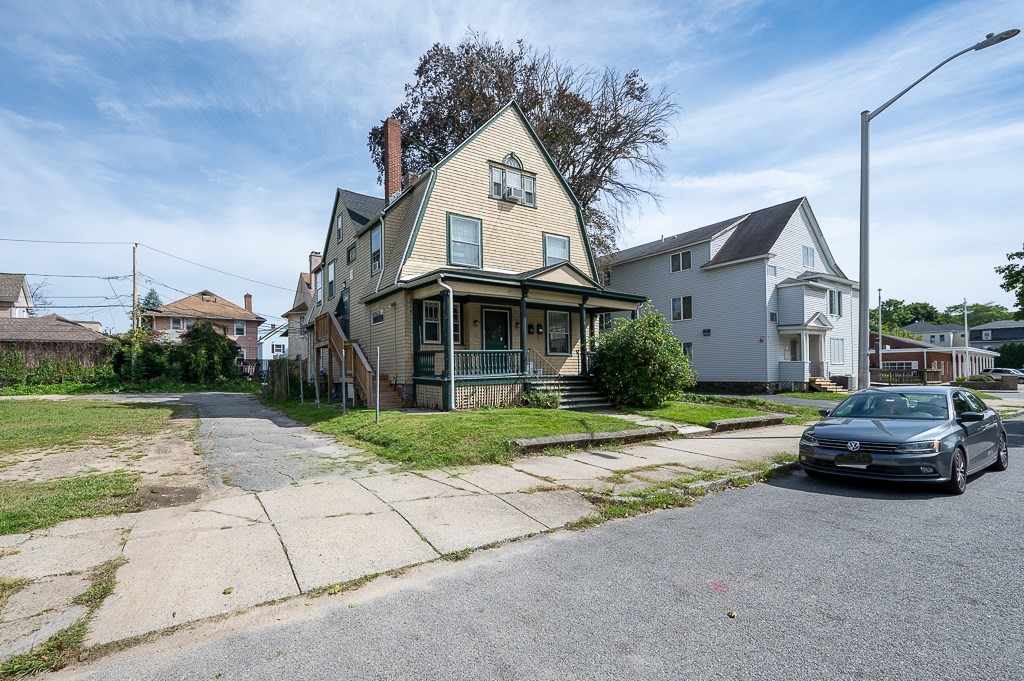 6 Dean Street Worcester, MA 01609 - Photo 1 of 40 a front view of a house with a garden