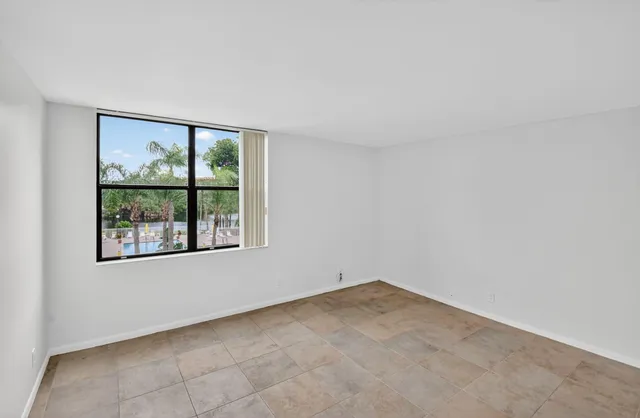 an aerial view of residential houses with outdoor space and lake view