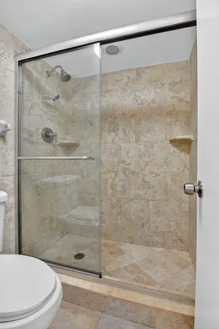 a view of a large building with a yard and plants