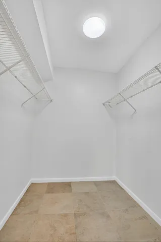 a view of a swimming pool with a garden and plants