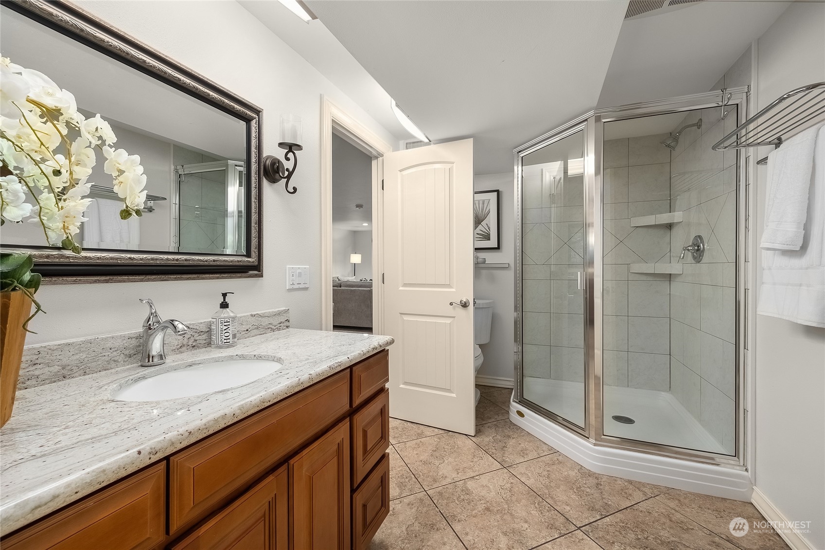 1818 Vernon Road Lake Stevens, WA 98258 - Photo 27 of 39 a bathroom with a granite countertop sink mirror and shower