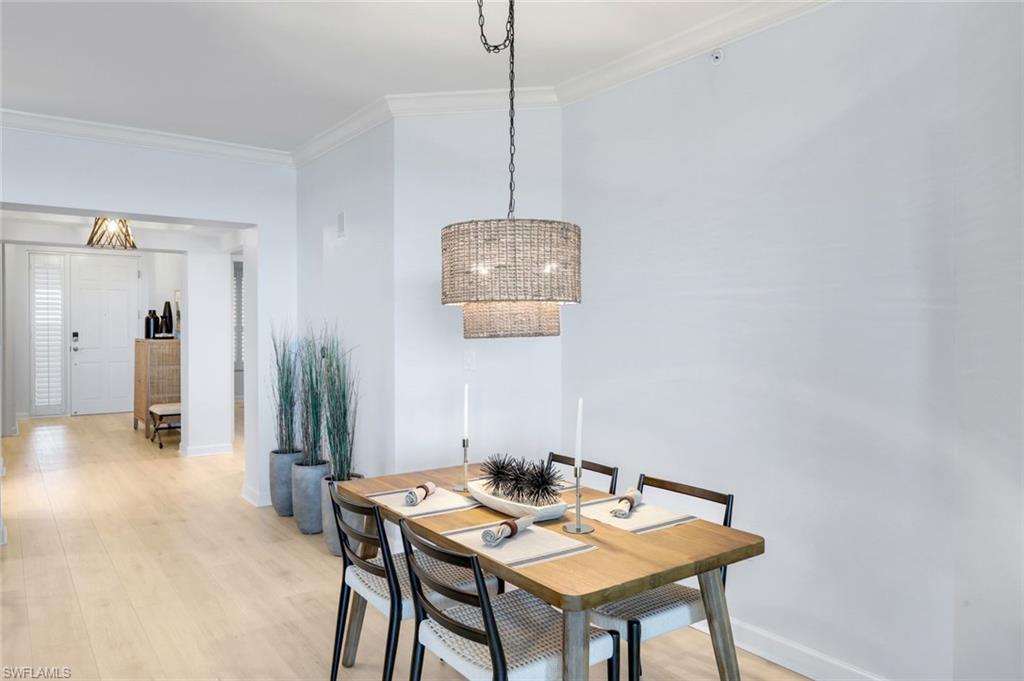 325 Dunes Boulevard, Unit 604 Naples, FL 34110 - Photo 13 of 41 a view of a dining room with furniture