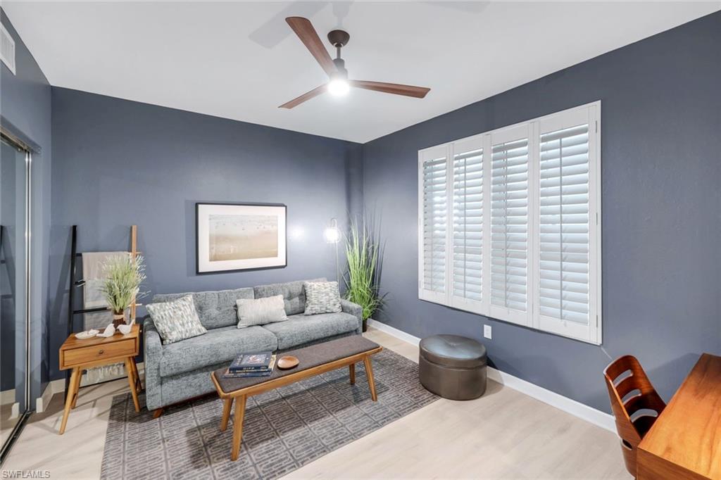 325 Dunes Boulevard, Unit 604 Naples, FL 34110 - Photo 20 of 41 a living room with furniture and a window