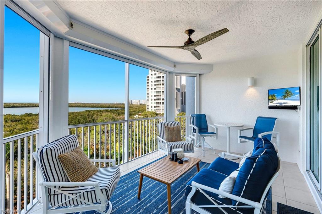 325 Dunes Boulevard, Unit 604 Naples, FL 34110 - Photo 22 of 41 a living room with furniture and a large window