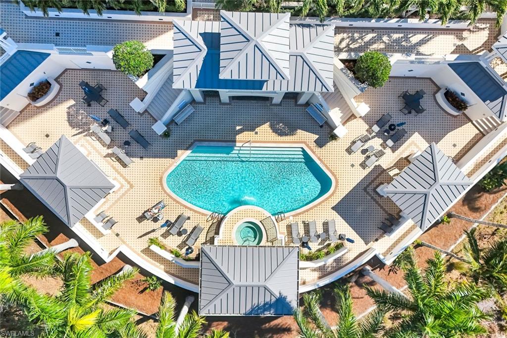 325 Dunes Boulevard, Unit 604 Naples, FL 34110 - Photo 25 of 41 an aerial view of a house with garden space and outdoor seating