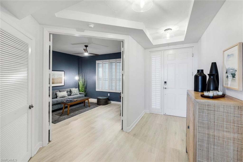 325 Dunes Boulevard, Unit 604 Naples, FL 34110 - Photo 6 of 41 a view of a livingroom with furniture and a bedroom