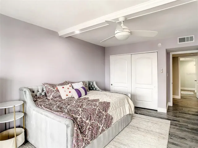 a bedroom with a bed and a lamp