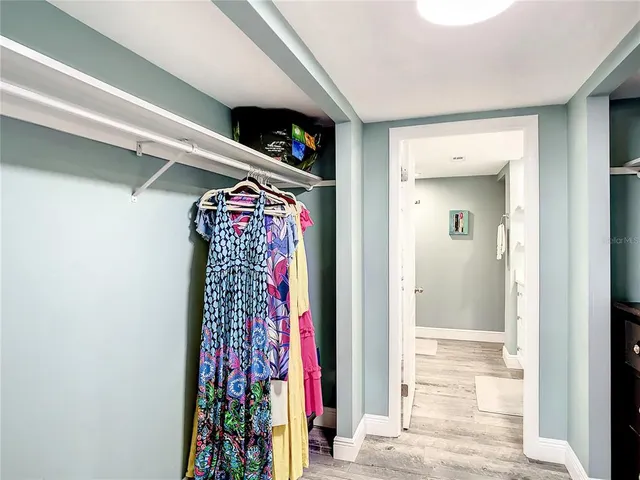 a en suite bathroom with a double vanity sink and a large mirror