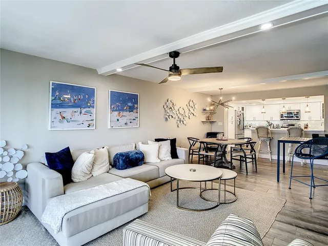 a kitchen with stainless steel appliances a refrigerator sink and cabinets